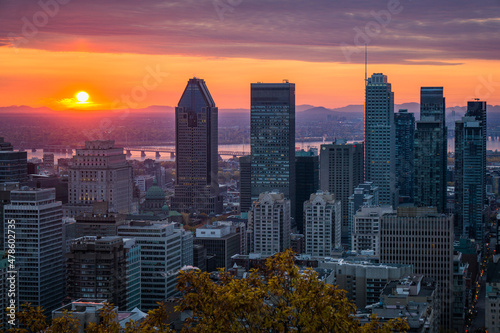 Sunrise over the skyline of Montreal  watched from the Kondiaronk Belvedere in Mont Royal Park.