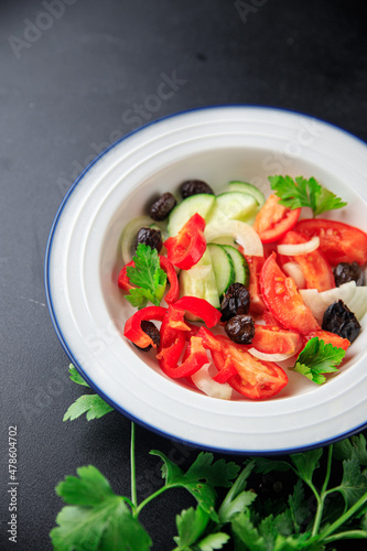 vegetable salad tomato, cucumber, olives, onion, pepper fresh spring healthy meal food snack on the table copy space food background