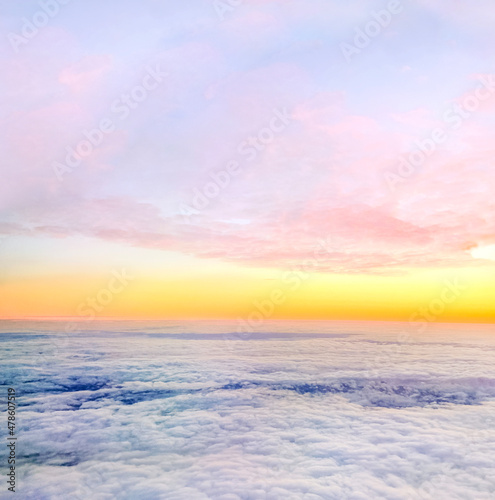 Clouds and sky background, bird's eye view at sunset, dawn, beautiful atmospheric pastel background