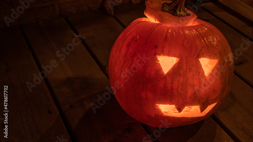 A close up of a jack-o-lantern pumpkin at halloween. photo