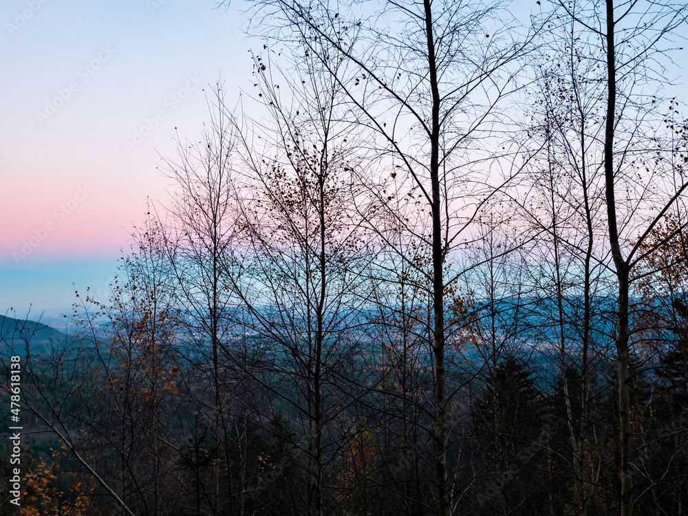 Obraz premium White snow and blue sky. Panoramic view of the silhouettes of the mountains.