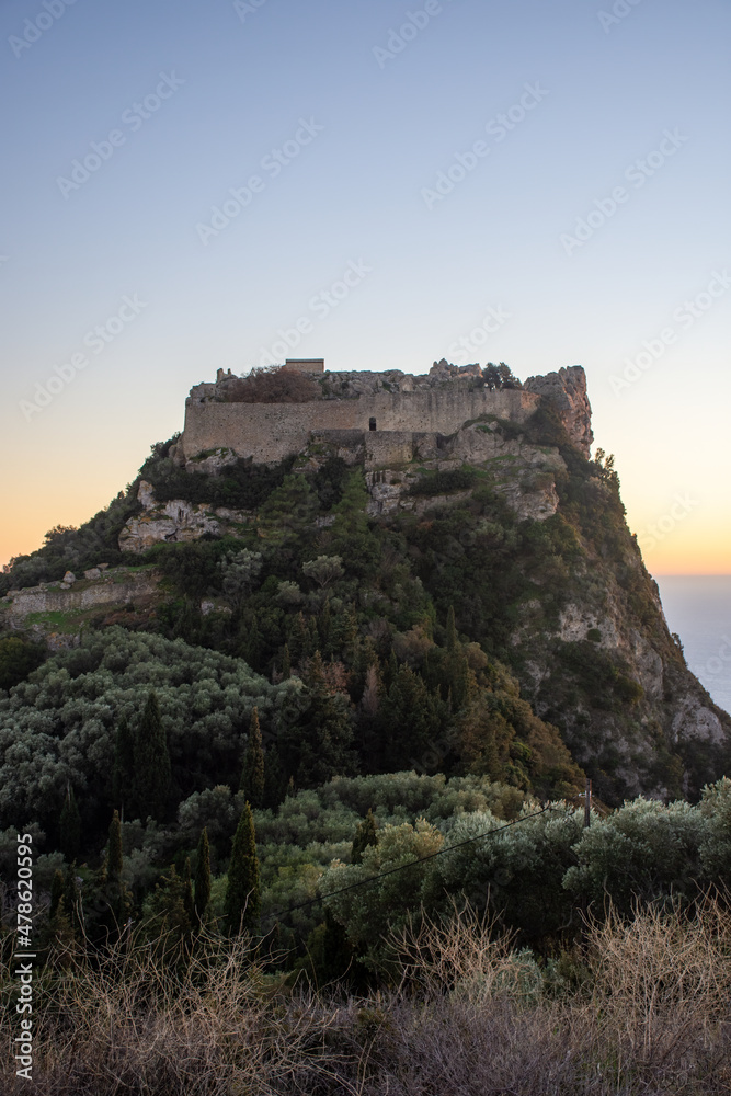  view of iconic medieval fortified castle of Aggelokastro with amazing views to Paleokastritsa bay, Corfu Greece