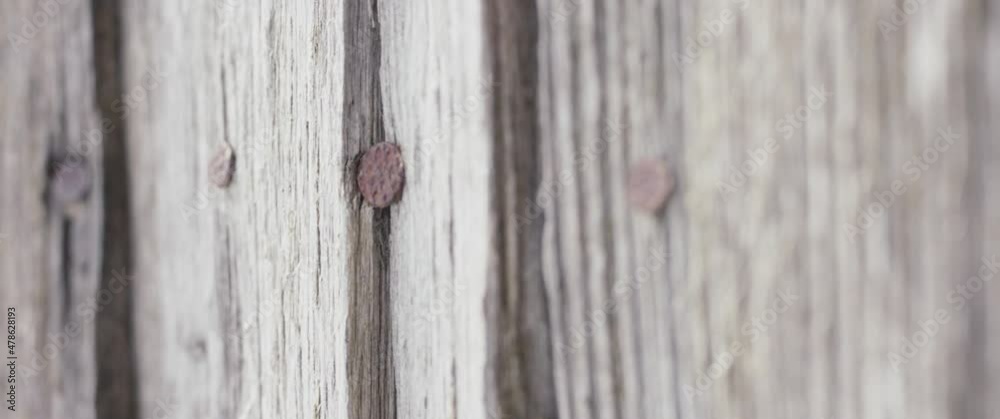 Old wooden facade rusty nails wood material in close up no people Old wooden facade rusty nails wood material in close up no people