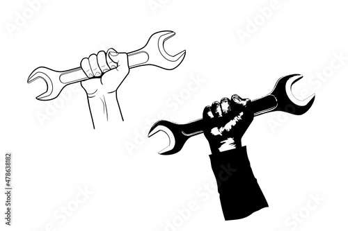 Worker's hand holds a large wrench black and white vector illustration isolated on the white background. Set of two illustrations