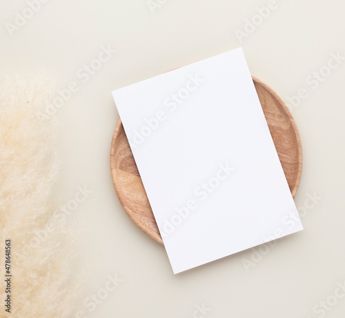 Blank paper cards, Mockup with pampas grass on a wooden plate, beige background, Minimal beige workplace composition, flat lay, mockup