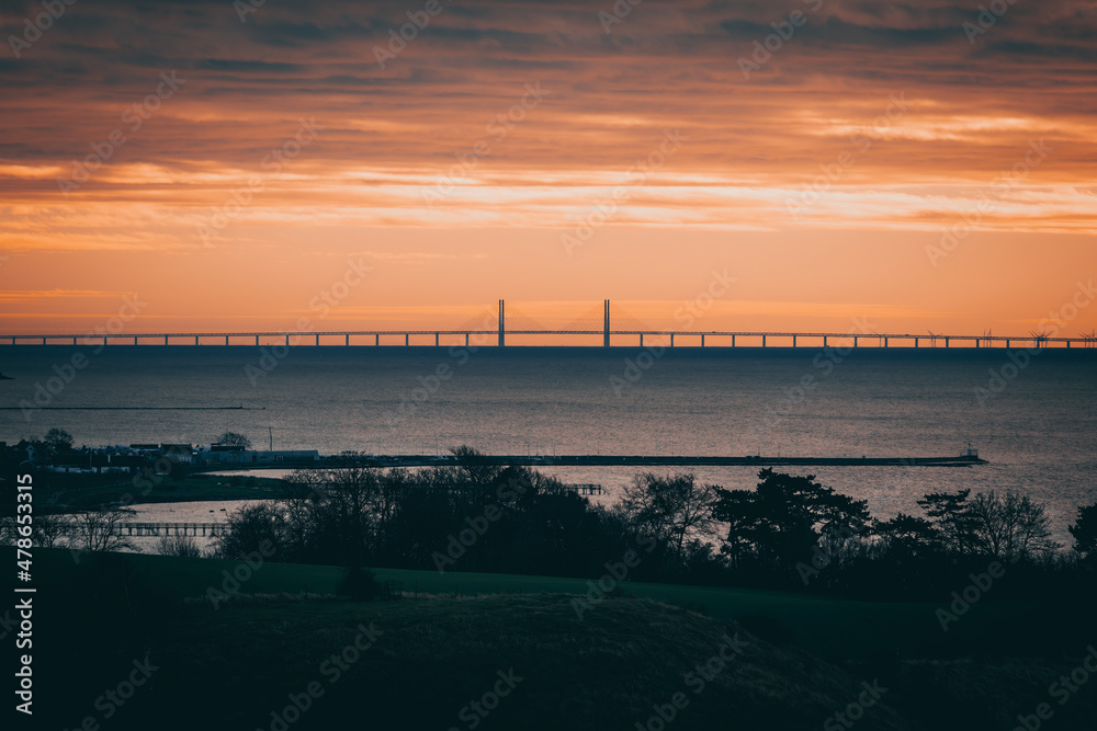 The Oresund Bridge is a combined motorway and railway bridge between Sweden and Denmark (Malmo and Copenhagen). Captured after sunset.