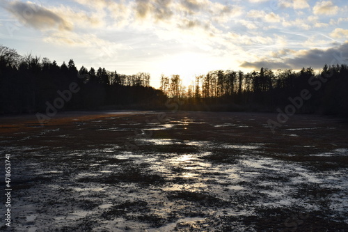 Sunset over water puddles © Alex Jauk