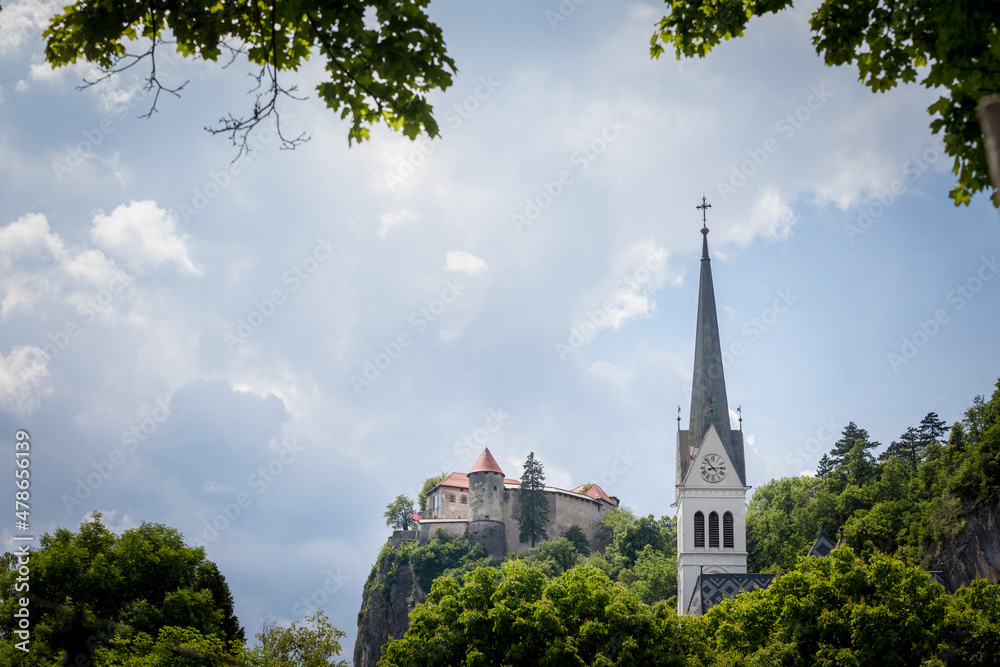 Panorama of Blejski Hrad and the Saint Martin church, or Cerkev Svetog Martina during a sunny afternoon. Bled Castle is a major monument of Slovenia.....