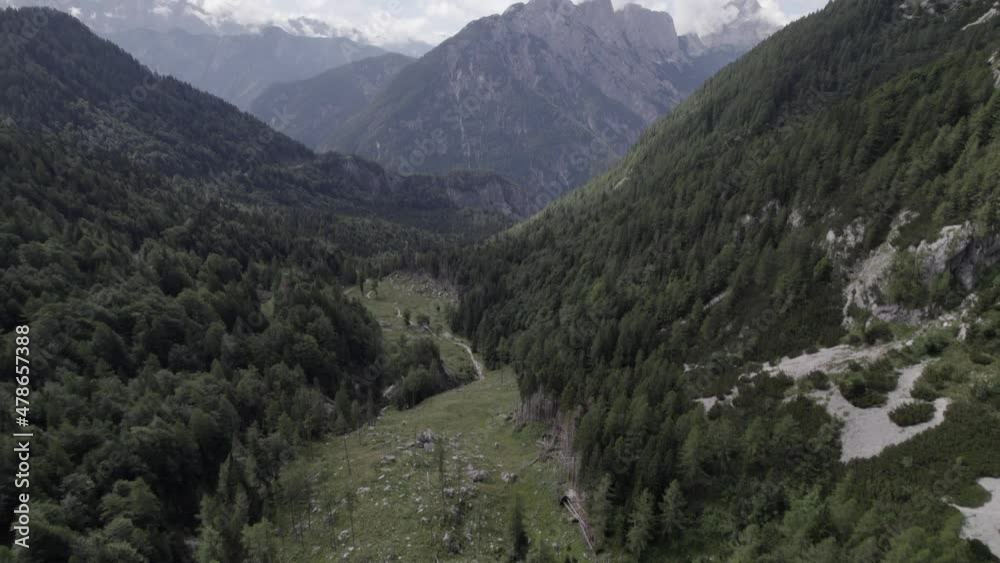 Drone video with descriptive frontal shot over the Vrsc pass in Slovenia with mountains on the horizon. Drone video with descriptive frontal shot over the Vrsc pass in Slovenia with mountains on the horizon.