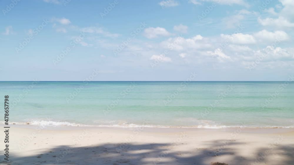 Sea wave on the sand of the tropical beach on sunny day. copy space provided. seascape and clouds sky. Sea wave on the sand of the tropical beach on sunny day. copy space provided. seascape and clouds sky.
