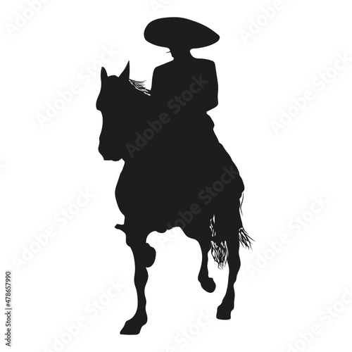 Charro or mexican cowboy vector. To ride a horse. Mexican charro, mariachi or cowboy rides a horse. Silhouette of a lonely mariachi with a charro hat. Mexican cowboy vector. Mexican mariachi. photo