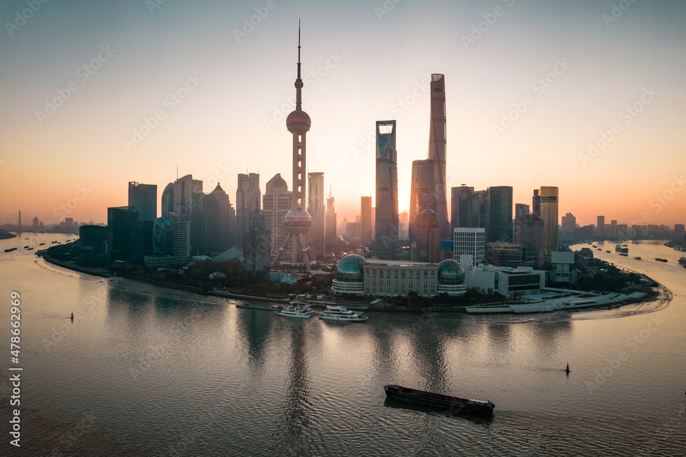 Aerial view of the skyscrapers in Lujiazui, the financial district in Shanghai, China, at sunrise. Aerial view of the skyscrapers in Lujiazui, the financial district in Shanghai, China, at sunrise.