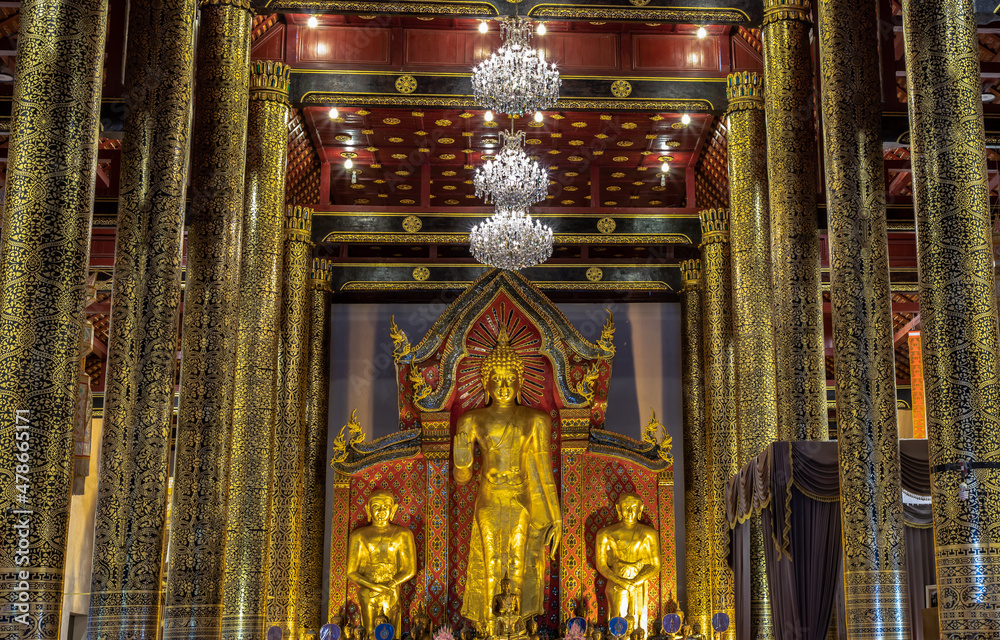 The golden buddha image inside the Buddhist church at the famous Wat Chedi Luang Varavihara It is a temple located in the Chiang Mai province at Thailand. Golden buddha, No focus, specifically.