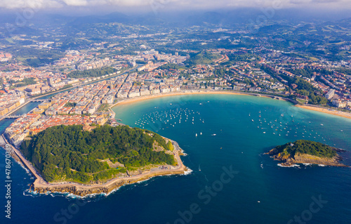 Fotografering Scenic view from drone of Spanish town of San Sebastian (Donostia) on southern coast of Bay of Biscay on sunny summer day, Basque Country