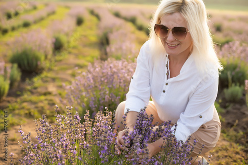 Beautiful blond hair girl in lavender meadow