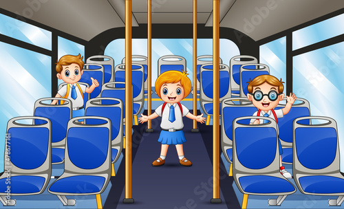 Happy school children on the school bus