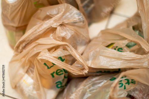Brown Plastic Bags filled with groceries on the floor