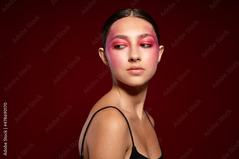Sexy brunette woman posing bright makeup fashion charm isolated background unaltered Sexy brunette woman posing bright makeup fashion charm isolated background unaltered
