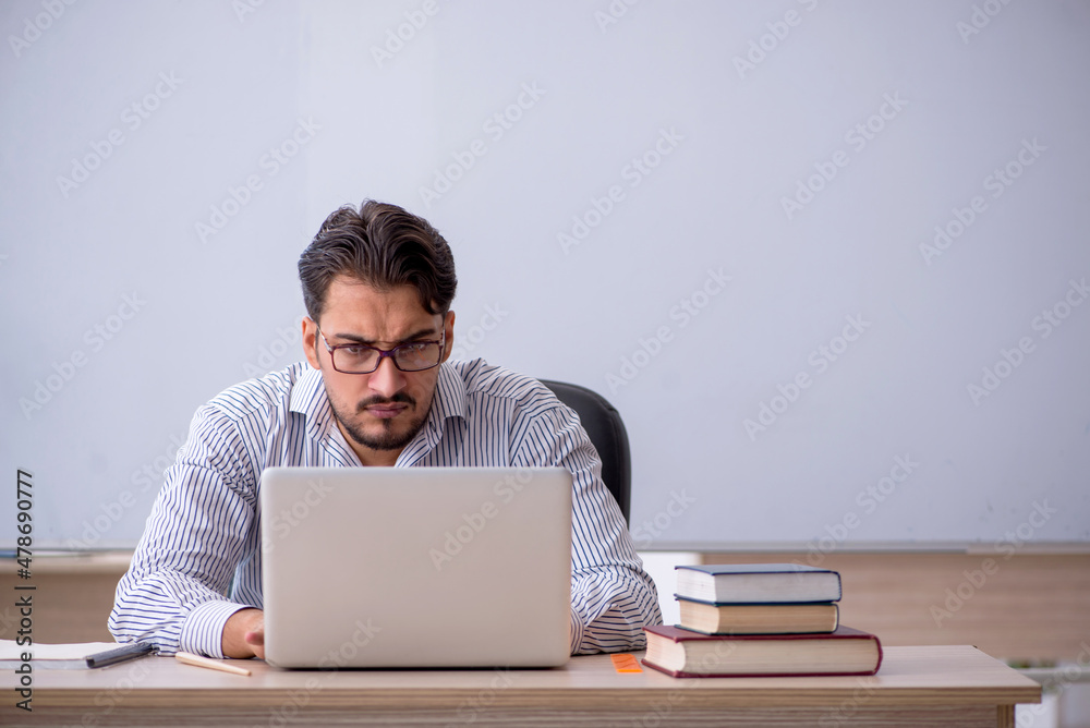 Young male teacher in telestudy concept Young male teacher in telestudy concept