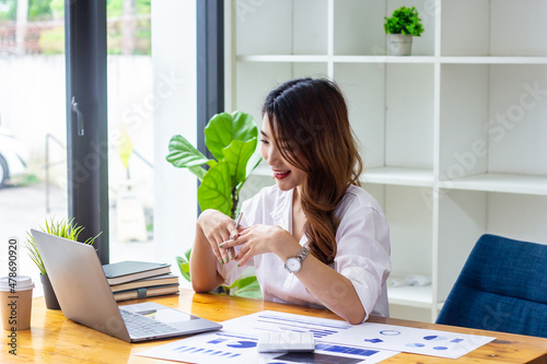 Businesswoman discussing company sales data last year at computer, woman looking at financial documents on computer, accountant checking company numbers, new business concept.