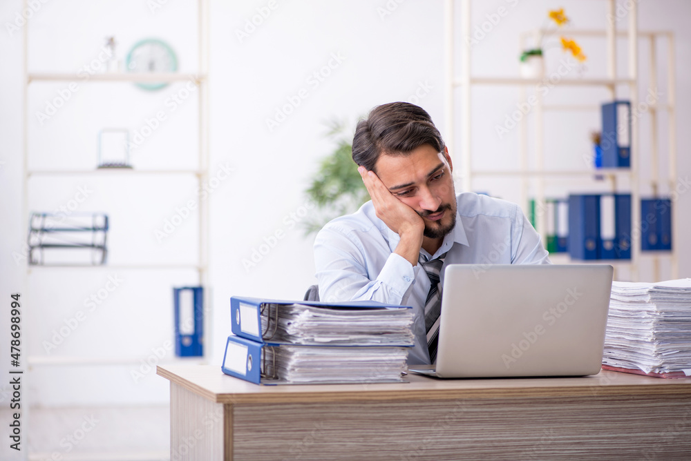 Young businessman employee working in the office Young businessman employee working in the office