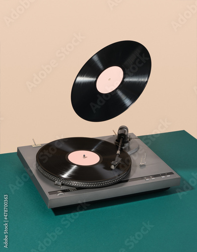 Bilde på lerret Retro composition of vinyl record player and floating record