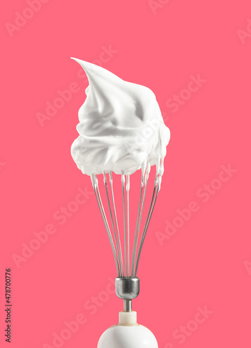 Whipped cream on the top of kitchen mixer. Process of making confectionery masterpiece. Sweet mood and aesthetics of cooking.