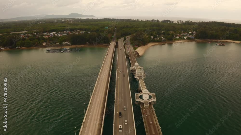Aerial View Drone shot of sarasin bridge Phuket thailand This bridge linking the province of Phang Nga.transportation footage background and travel season concept Aerial View Drone shot of sarasin bridge Phuket thailand This bridge linking the province of Phang Nga.transportation footage background and travel season concept