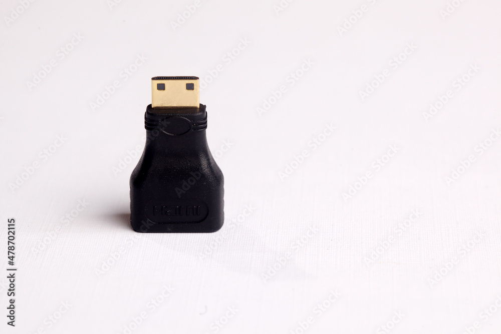 High-Definition Multimedia Interface or HDMI to mini HDMI adapter isolated on white. High-Definition Multimedia Interface or HDMI to mini HDMI adapter isolated on white.