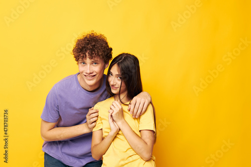 portrait of a man and a woman in colorful t-shirts posing friendship fun Lifestyle unaltered