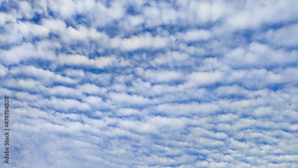 A beautiful fluffy clouds with blue sky in bright day for background backdrop