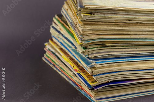 Collection of old comics and magazines against a gray background