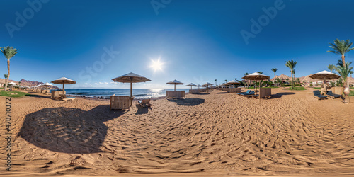Fototapeta Naklejka Na Ścianę i Meble -  full seamless spherical hdr 360 panorama view on coast of sea with wooden beach umbrellas and sun loungers by red sea in bright sunny day in equirectangular projection, ready for VR AR virtual reality