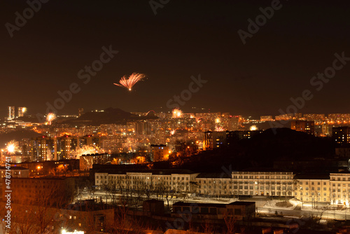 Fireworks in the city at night during New Year celebration. Soft focus background