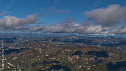 Beautiful panoramic view of subalpine mountain range Baronnies viewed from the top of popular Mont Ventoux in Provence region, France on sunny day. © Timon