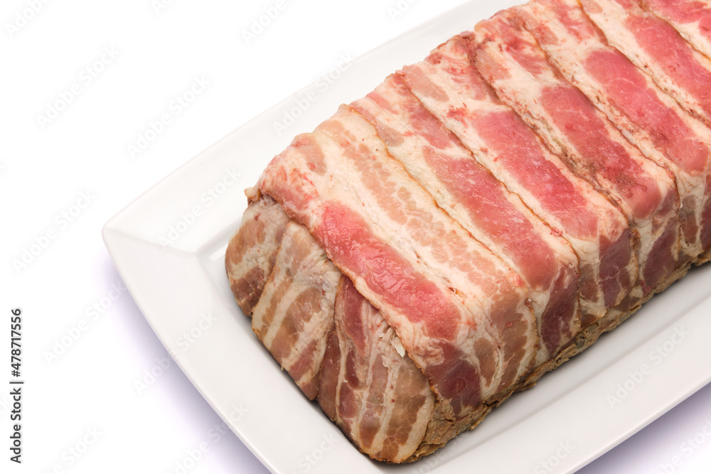 Traditional French terrine covered with bacon isolated on white background