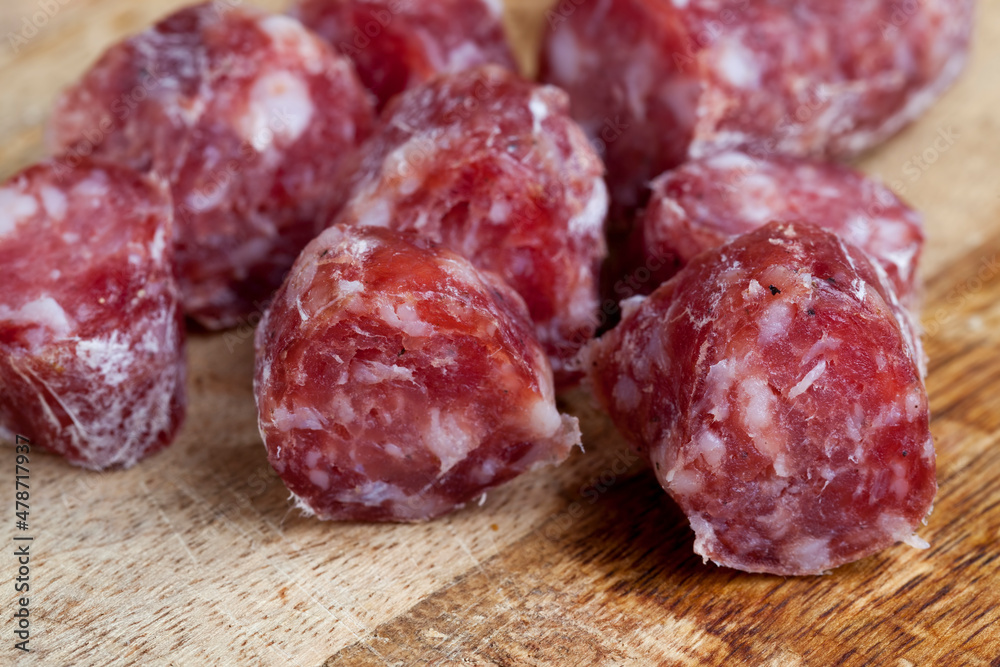 sliced sausage of dried meat with bacon