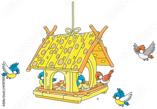 Merry small sparrows and titmice flying around a fancy birdfeeder hanging on a branch, vector cartoon illustration isolated on a white background