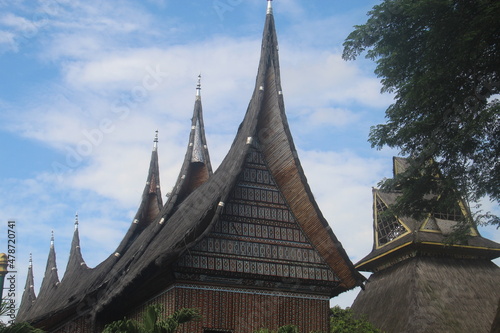 Minangkabau Traditional House (Rumah Gadang), West Sumatra, Indonesia on a cloudy sunny bright sky