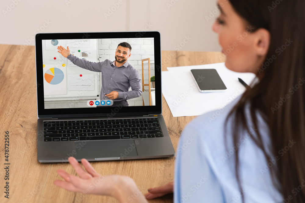Businesswoman Having Online Business Meeting Sitting At Laptop In Office Businesswoman Having Online Business Meeting Sitting At Laptop In Office