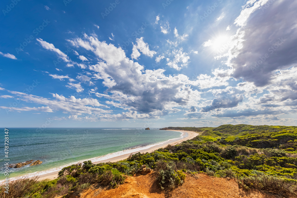 Australia, Victoria, Summer clouds over coastal landscape of Bay of Martyrs