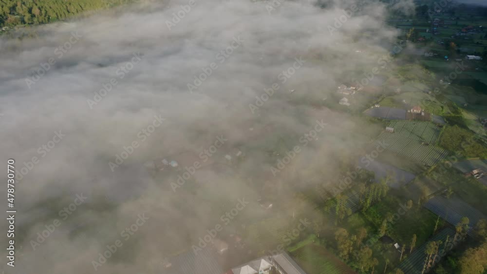 Mount Batur Caldera filled with mist during morning sunrise, aerial Mount Batur Caldera filled with mist during morning sunrise, aerial