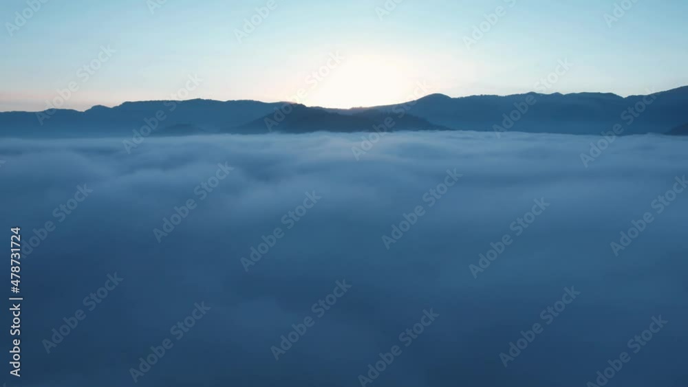 Hyperlapse Drone Aerial View Flying Above Beautiful Heavenly Clouds During Epic Sunrise With Mountains In Background. Hyperlapse Drone Aerial View Flying Above Beautiful Heavenly Clouds During Epic Sunrise With Mountains In Background.