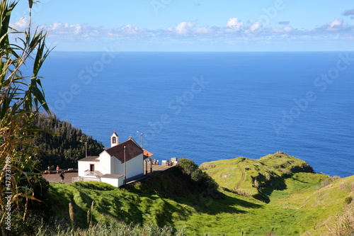 The chapel of Nossa Senhora de Fatima, located at the top of a green hill near Sao Vicente in the North of Madeira Island, Portugal photo