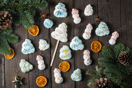 Airy biscuits in the shape of snowmen and Christmas trees.Christmas and New Year concept.