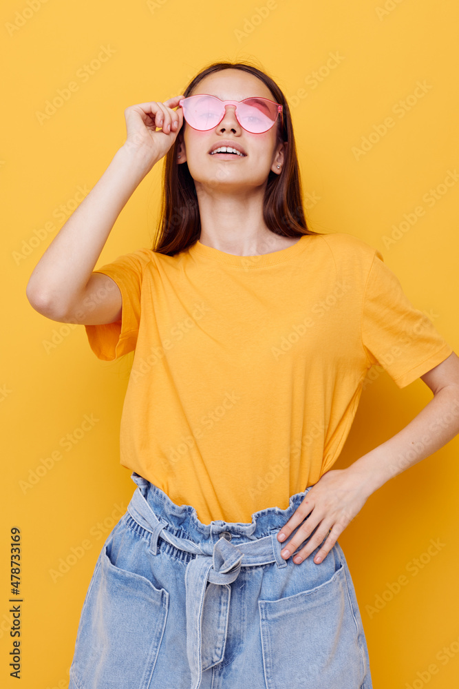 young beautiful woman in a yellow t-shirt emotions summer style isolated background young beautiful woman in a yellow t-shirt emotions summer style isolated background