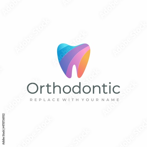 Dental logo with a rainbow color tooth icon