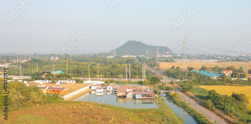 High voltage poles with nature landscape. Power lines on utility tower and cable wires in energy electric technology, network, and industry concept. Generator pylon. Transmission and substation.