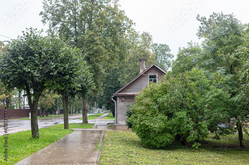 village street in rainy day. Overcast summer day