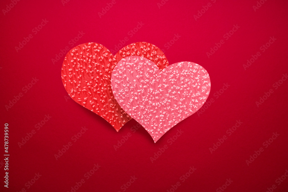 Red background with double hearts (red and pink), romantic background for Valentine's Day or wedding.